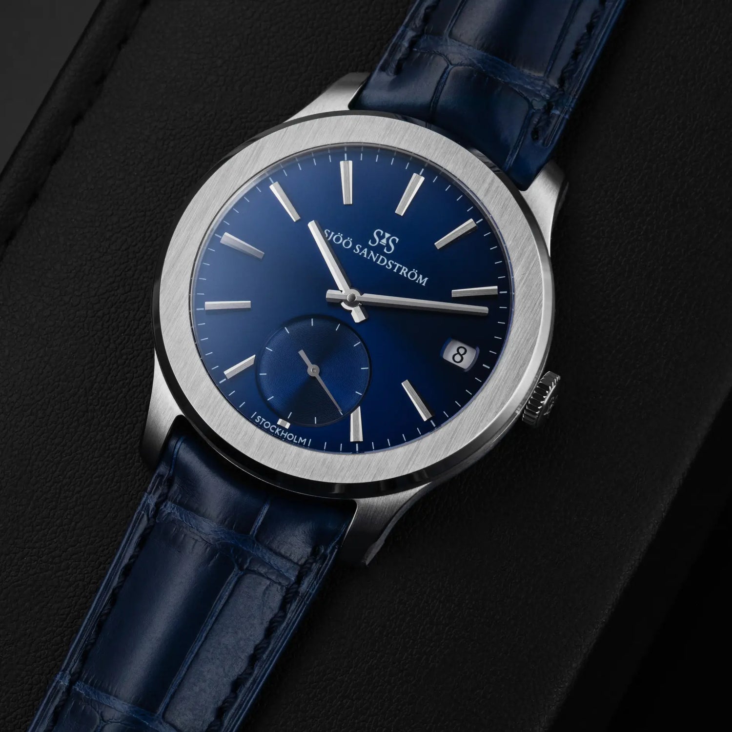 Collection of Sjöö Sandström watches showcasing Scandinavian design, precision craftsmanship, and customizable options, displayed on a branded mat.